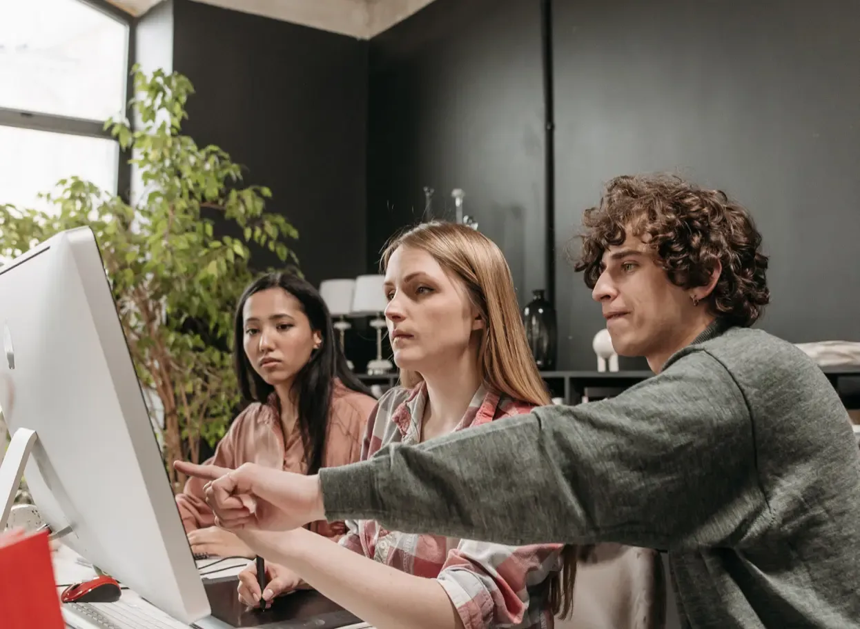 Team working together at a computer screen