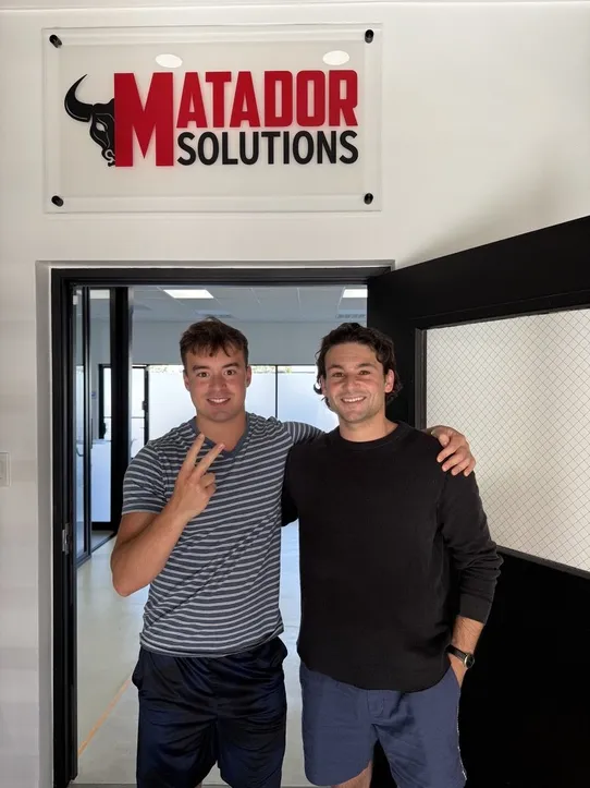 Teammates at the Matador office entrance